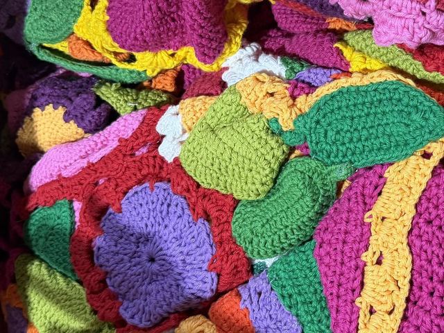 Close view of brightly colored crocheted circles