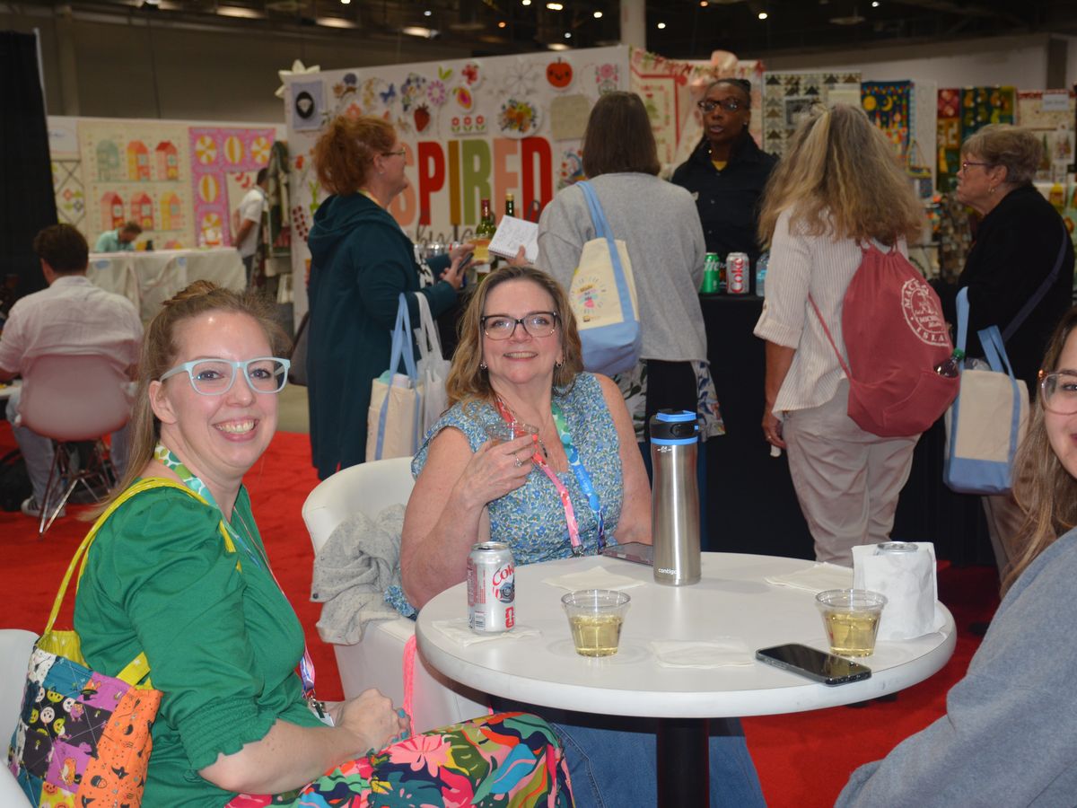 Buyers taking a break at a table on the Fall Edition show floor