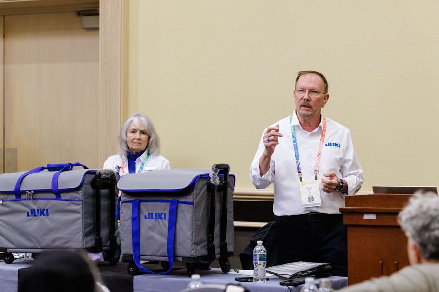 A sewing machine demonstration at the show