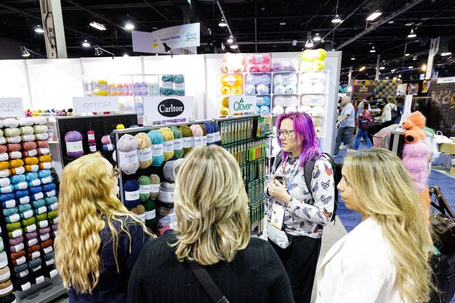 A wall of yarn at an exhibitor booth